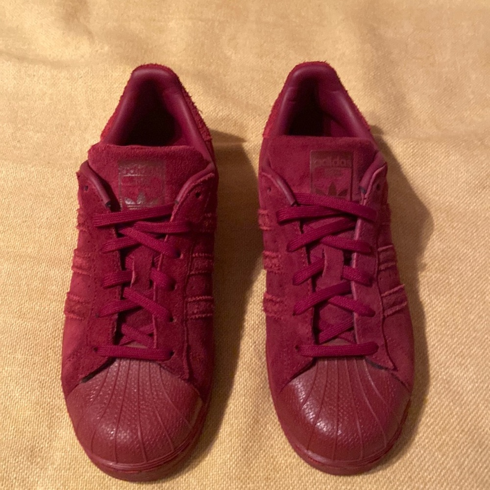 Burgundy suede adidas super stars